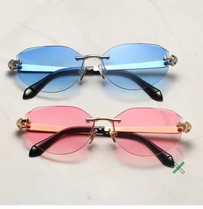 Detail of rimless polygon lenses with gold bridge and luxury leopard head metal temple relief