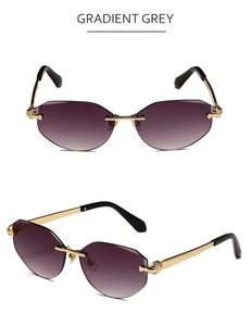 Detail of rimless polygon sunglasses with gold leopard head relief and gradient grey lenses