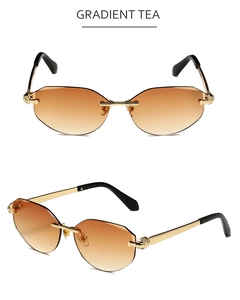 Macro shot of rimless sunglasses with gold leopard head decor and gradient tea lenses