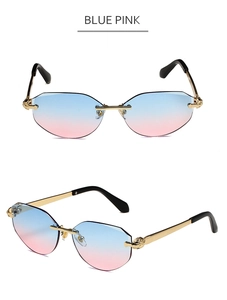 Close-up of blue-pink gradient lenses and gold animal head relief on rimless sunglasses