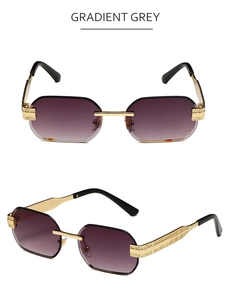 Close-up of gradient grey lenses and detailed golden embossed metal temples on rimless sunglasses