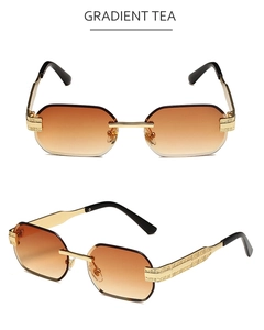 Close-up of geometric engraved golden metal temples on gradient tea rimless sunglasses