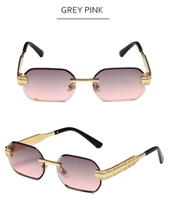 Macro detail of rimless polygonal sunglasses with grey pink gradient lenses and gold metal arms