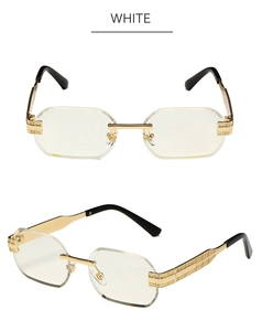 Detail of rimless polygon sunglasses with golden engraved metal arms and white lenses