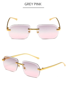 Vue détaillée des verres dégradés gris-rose sur des lunettes de soleil sans monture