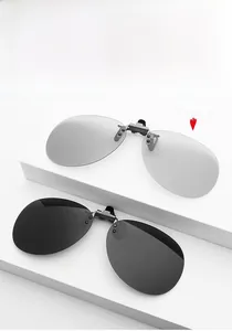 Polarized square clip-on sunglasses showing photochromic transition from light to dark grey