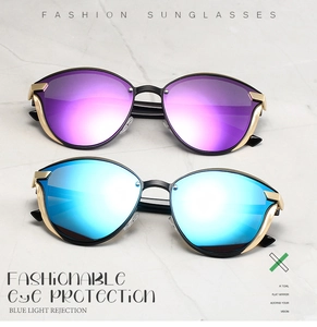 Detail of polarized sunglasses with purple and blue lenses and golden metal frames