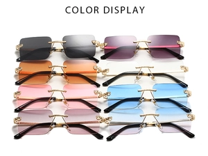 Close-up of leopard head detail on luxury rimless sunglasses in various lens colors