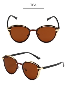 Detailed front and 45-degree angle view of tea-tinted polarized cat-eye sunglasses