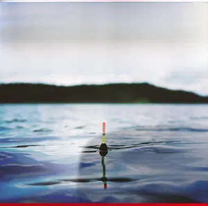 Polarized lens detail showing glare reduction effect on water for fishing sunglasses