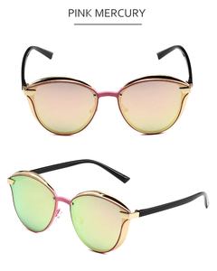 Close-up of pink mercury cat eye sunglasses with gold and pink metal frames