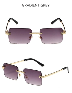 Detail of rimless square sunglasses with gradient grey lenses and textured gold metal temples