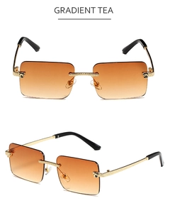 Detail of rimless rectangle sunglasses with gradient tea lenses and golden metal frames