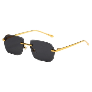 Lunettes de soleil carrées sans monture avec verres dégradés et monture en métal doré