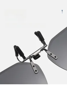 Close-up of double-sided silicone pads on polarized sunglasses clip to prevent lens scratches