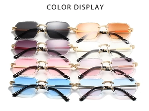 Detailed color display of rimless polygon sunglasses with golden textured metal frames