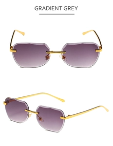 Macro detail of rimless square sunglasses with gradient grey lenses and golden metal temples