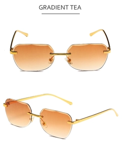Detail view of rimless gradient tea polygon lenses with elegant gold metal frames