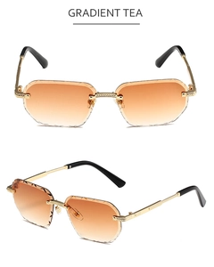 Detail of rimless polygon sunglasses with gradient tea lenses and engraved edge patterns