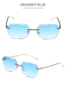 Macro detail of rimless gradient blue sunglasses with sleek silver metal frames