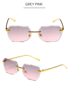 Detail of rimless square sunglasses with gold metal temples and grey pink gradient lenses