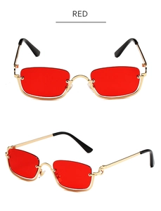 Detail view of red square lenses with thin gold metal frame hip-hop style sunglasses