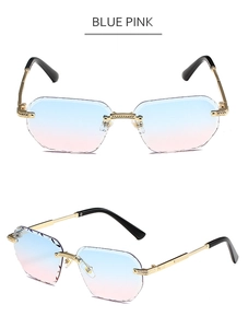 Close-up of rimless gradient blue pink sunglasses with diamond-cut lens edges and gold frame