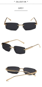 Detail view of rimless grey sunglasses with gold metal temples and rivet textures