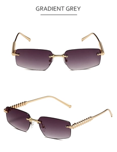 Detail of gradient grey rimless sunglasses with gold textured metal temples