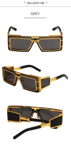 Detail view of steampunk rectangle sunglasses with bold gold metal frames and grey lenses