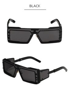 Detail view of steampunk oversized sunglasses with thick black frames and side shields