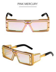 Macro view of steampunk oversized square sunglasses with gold metal frame and pink mercury lens