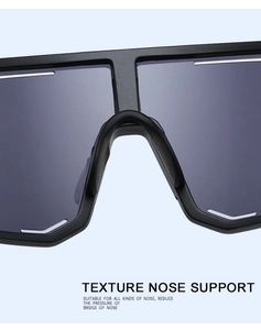 Detail of integrated texture nose support on polarized cycling sunglasses for comfort