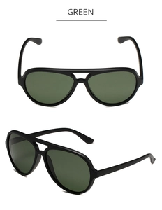 Detail of green polarized lens and matte black frame on aviator sport sunglasses