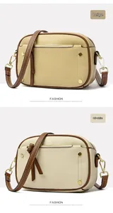 Detail of lychee pattern leather handbags in beige and off-white with gold hardware