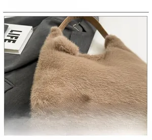 Detailed macro view of plush brown handbag featuring wooden handle and fashion girl patch