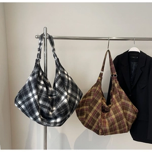 Detail of tweed checkered tote bags in black-white and retro color patterns