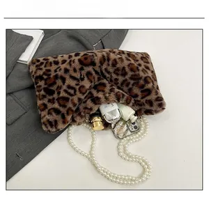 Leopard print plush handbag capacity showing phone, lipstick and cream with pearl chain