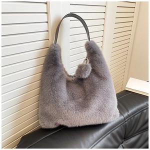 Fuzzy grey faux fur tote bag with leather strap and pompom charm for autumn winter