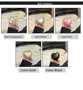 Detailed view of heart-shaped mini acrylic evening bags in five different colors with chains