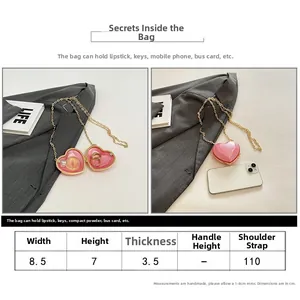Size guide showing a pink heart mini acrylic bag with dimensions and gold chain details