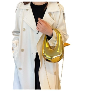 Golden mirror acrylic half-moon evening clutch with metallic chain strap shown with model
