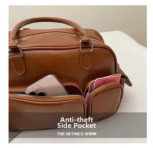 Detail showing anti-theft side pocket on brown crossbody bag with phone and card holder