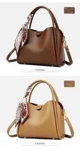 Close-up of litchi grain leather handbags with floral scarves and gold hardware