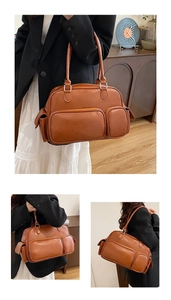 Retro brown Boston bag detail showing multiple functional pockets and matte leather texture