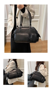 Detail of black multi-pocket crossbody bag showing side flap and high-gloss leather finish
