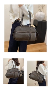 Detail view of large dark brown tote bag with multiple pockets and shoulder straps