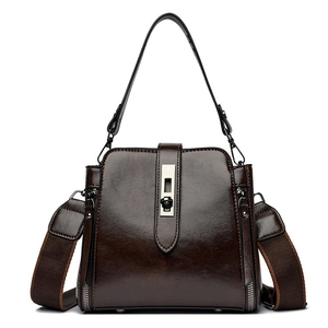 Fashionable dark brown PU leather bucket bag with retro metal lock and wide strap
