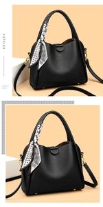Detail of black litchi grain leather tote with silk scarf and spaghetti shoulder straps