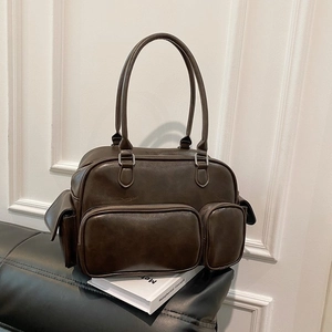 Detail of dark brown retro PU leather crossbody bag featuring multiple functional pockets